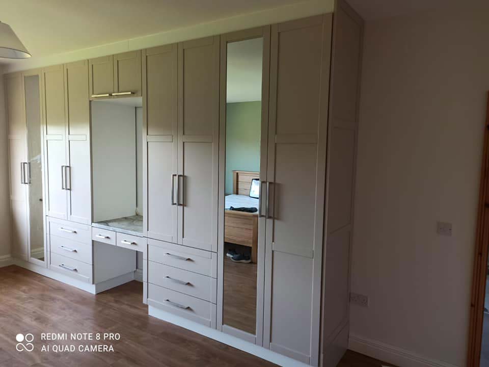 Wardrobe in the beautiful Elephants breath colour with a vanity in the middle